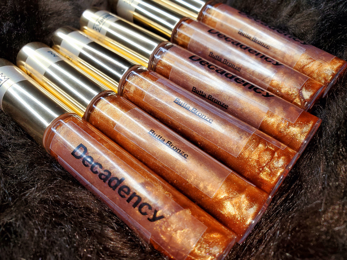 Decadency Lip Gloss “Butta Bronze”